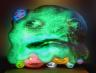 Tony Oursler, Alien Acid, 2007. Video installation. Fiberglass element. 114 x 142 x 56 cm. DVD video projection with sound. Performance Tony Oursler, Vanessa Carreras, Tracy Leipold. Courtesy Galerie Forsblom